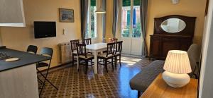 a kitchen and living room with a table and chairs at Il Veliero in Bonassola