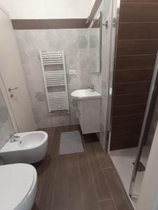 a bathroom with a toilet and a sink and a shower at Il Veliero in Bonassola +30 photos