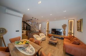 a living room with a couch and a table at Apartments Nikčević in Kotor