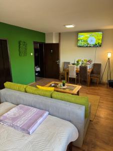 a living room with a couch and a table at Apartments Veljanov - Sofra in Negotino