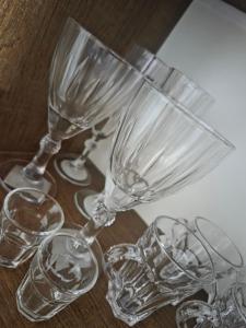 a group of wine glasses sitting on a table at Flat 02 Carvalhos de Aldeia in Recife