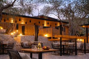 an outdoor dining area with tables and chairs at Azure Olive Collection in Ulcinj