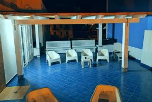 a row of chairs and a row of benches on a cruise ship at Zagma Un Passo Dal Mare in Canneto
