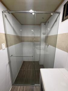a shower with a glass door in a bathroom at Edificio La Roca in Pereira