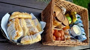 two baskets of bread and eggs on a wooden table at Robins Rest in Donegal +33 photos