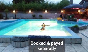 a woman is swimming in a swimming pool at Wallander's hometown, close to beach & café in Ystad
