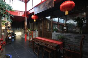 Restoranas ar kita vieta pavalgyti apgyvendinimo įstaigoje The Great Wall Courtyard Hostel