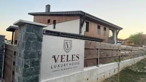 a building with a sign that reads vales luxury house at Veles Luxury House in Hisarya