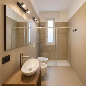 a bathroom with a sink and a toilet and a shower at Affittacamere Villa Soria in Pesaro