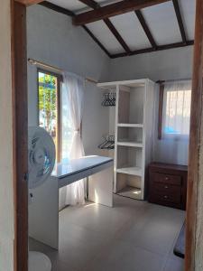 a room with a desk and a window at Playa VICTORIA in Arboletes