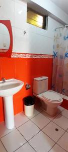 a bathroom with a toilet and a sink at Hotel Selena 1 in Huaraz +77 photos