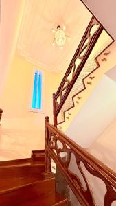 a staircase in a house with a chandelier at Terra do Sol Pousada - Passarela in Porto Seguro +53 photos