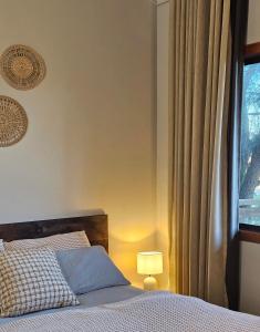 a bedroom with a bed and a window at 12 Apostles Cottages - Tullarook in Princetown