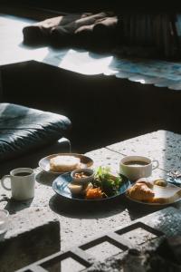 a table with plates of food and two cups of coffee at RoheN ASHINOKO in Hakone