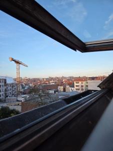 a view of a city from a window at Peaceful Pad in Brussels