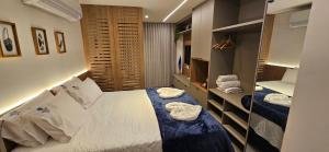 a bedroom with a bed with towels on it at Beach Class Verano Muro Alto in Porto De Galinhas +38 photos