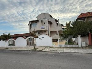 a building on the side of a street at Siana House in Ravda