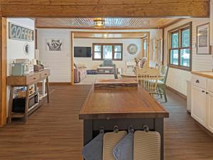 a kitchen and living room of a tiny house at Ultimate Hayward Trailhead Cabin - Base Camp 77 in Hayward