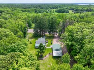 an overhead view of a house in the woods at Ultimate Hayward Trailhead Cabin - Base Camp 77 in Hayward