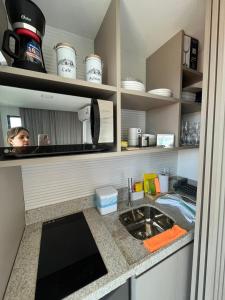 a kitchen with a counter top with a sink at Flat à Beira Mar com Varanda em Frente as Piscinas Naturais 307 in Porto De Galinhas