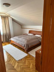 a bedroom with a bed in a room at Villa Lana in Bihać