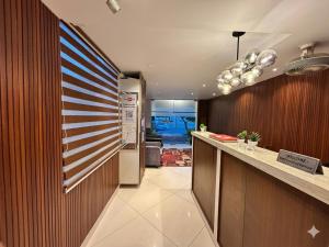 a kitchen with an american flag on the wall at De Classico Hotel - HBR Layout in Bangalore