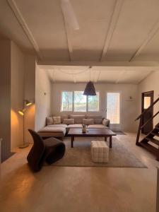 a living room with a couch and a table at Mirramor in Campo de Mirra +72 photos