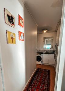 a hallway leading to a kitchen with a room at Patons Rock Cutie in Rangihaeata