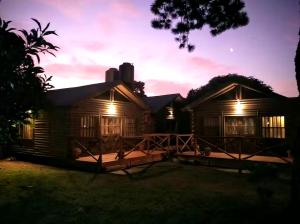 a house at night with the lights on at Gasty Ranch in Mar del Plata +7 photos