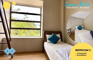 a bedroom with two bunk beds and a mirror at Harmony Serene 3BR Nomad Sematan Beach Resort in Sematan