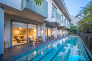 an image of a swimming pool in a villa at Studio O - Two-Floor Studio, Walk to the Beach in Seminyak