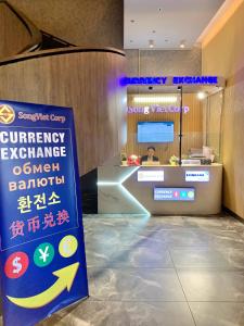 a sign in front of a counter in a store at Panorama Blue Beach Nha Trang in Nha Trang +50 photos