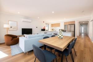 a living room with a couch and a table at Greenview Place - Officer in Officer