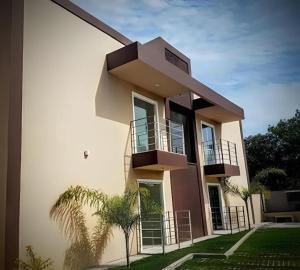 a building with balconies on the side of it at Residencial Villa dos Corais - Staybeach in Porto Seguro