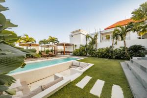 an image of a villa with a swimming pool at Botanique Villa & Studio in Tanah Lot