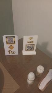 a table with two boxes on top of it at Studio Premium Trianon Centro in Campos dos Goytacazes