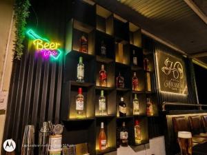 a bar with bottles of alcohol on the wall at HOUSSE 69 Café Bar in Satipo