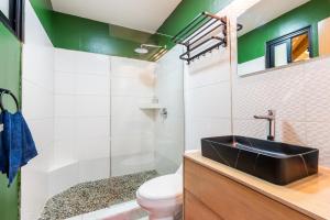 a bathroom with a sink and a toilet at La Brisa del Mar in Bastimentos +76 photos