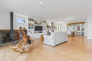 a living room with a couch and a fireplace at Stunning Views by the Bay 2BR in Brisbane