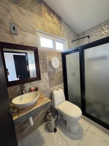 a bathroom with a toilet and a sink at Casa Escondida in San Felipe +56 photos
