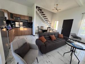 a living room with a couch and a table at Casa Escondida in San Felipe