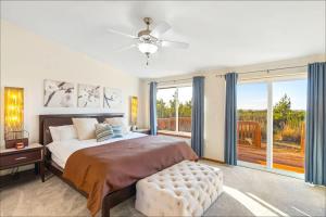 a bedroom with a large bed and a large window at Ocean Front Clamming Game Room Large Deck in Ocean Shores