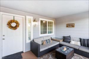 a living room with a couch and a door at Ocean Front Clamming Game Room Large Deck in Ocean Shores +47 photos