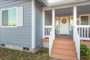 a front porch of a house with a wreath at Ocean Front Clamming Game Room Large Deck in Ocean Shores