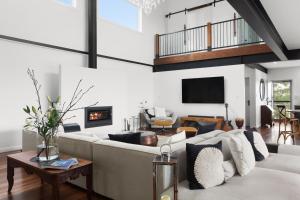 a living room with a couch and a fireplace at The View @ Ulandi in Lowther