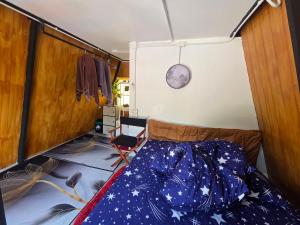 a bedroom with a bed with a star pattern on the floor at CK Family in Nakhon Nayok