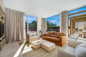 a living room filled with furniture and a large window at Lucia Sorrento in Sorrento