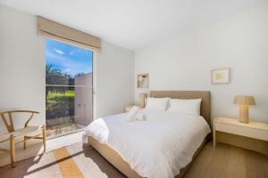a bedroom with a bed and a large window at Lucia Sorrento in Sorrento