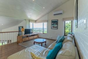 a living room with a couch and a table at 3BR Lakeside Home Mountains Beach Nearby in Cape Town
