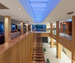 a hospital corridor with a long hallway with a long staircase at Elysia Wellness Retreat in Pokolbin